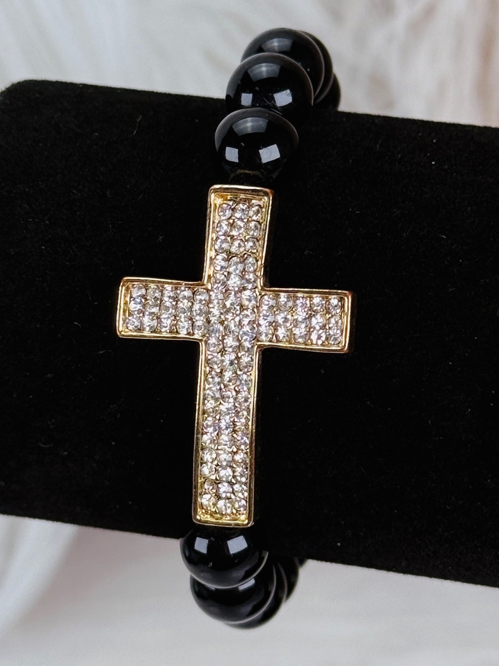 Pretty black goldtone bling cross accent stretch bracelet